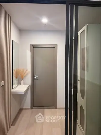 Modern hallway with sleek design and minimalist decor in a contemporary apartment.