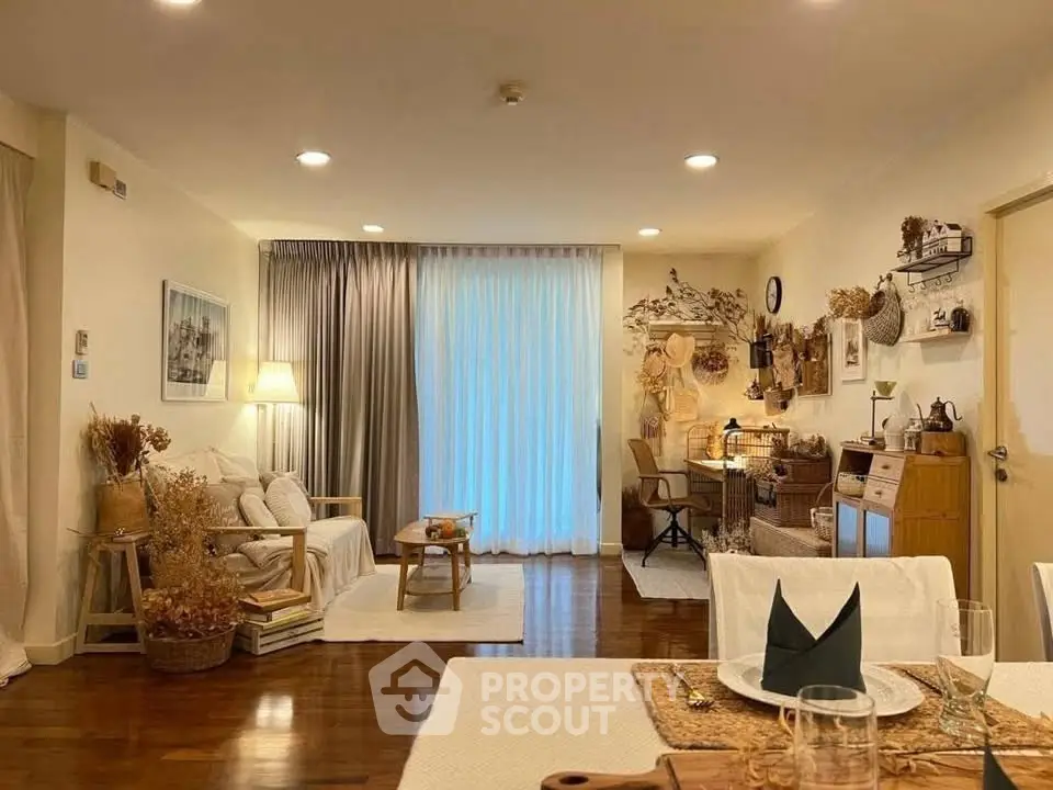 Charming living room with cozy decor and warm lighting, perfect for relaxation and entertaining.