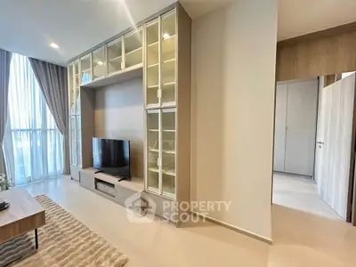 Spacious modern living room with built-in shelving and large windows