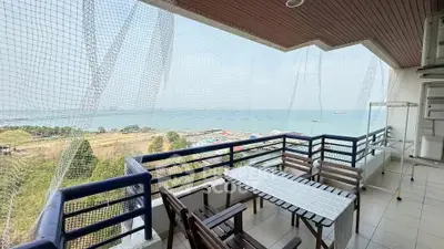 Spacious balcony with stunning sea view, perfect for relaxation and outdoor dining.