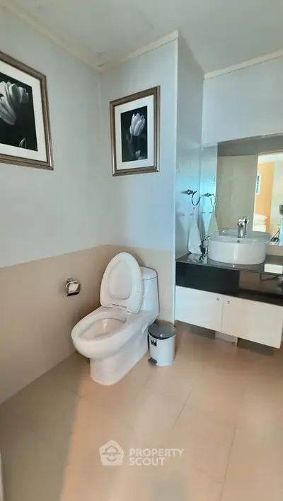 Modern bathroom with elegant decor and sleek fixtures in a contemporary home.