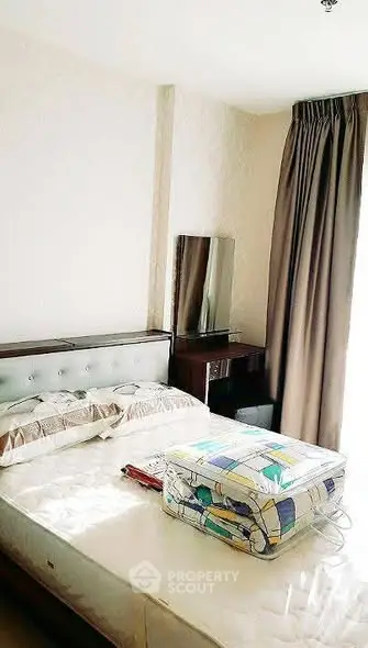 Cozy bedroom with natural light and modern furnishings