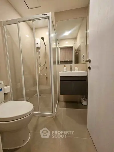 Modern bathroom with glass shower and sleek fixtures