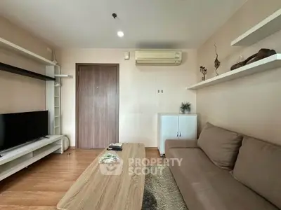 Modern living room with sleek furniture and air conditioning, perfect for relaxation and entertainment.