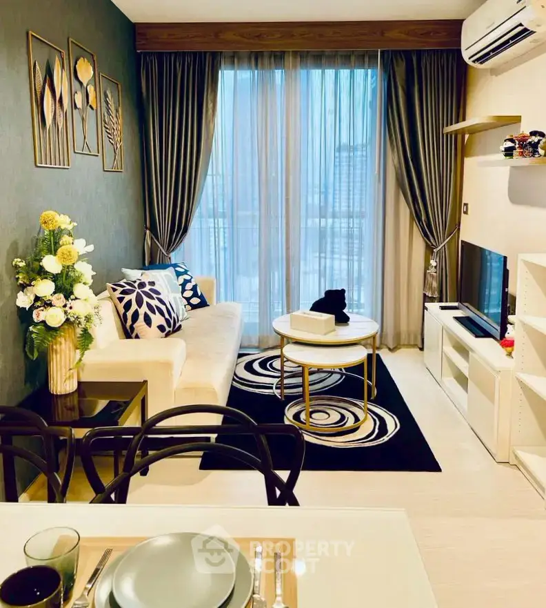 Stylish modern living room with elegant decor and large window view.