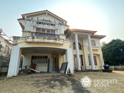 Stunning two-story house with classic columns and spacious yard for sale.