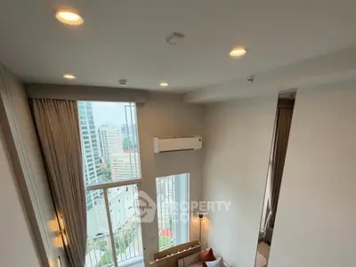 Stunning high-rise apartment with floor-to-ceiling windows and city views