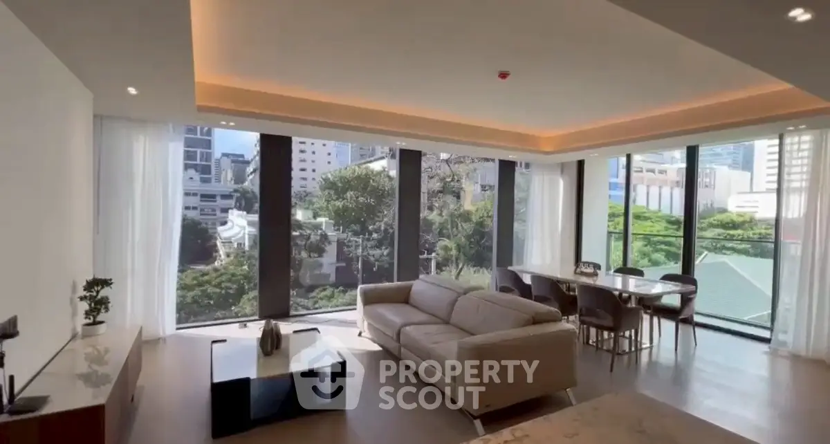 Luxurious living room with panoramic city views and modern furnishings