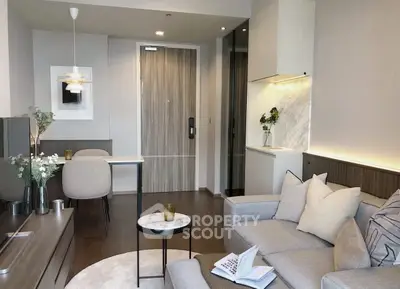 Modern living room with stylish decor and open kitchen layout