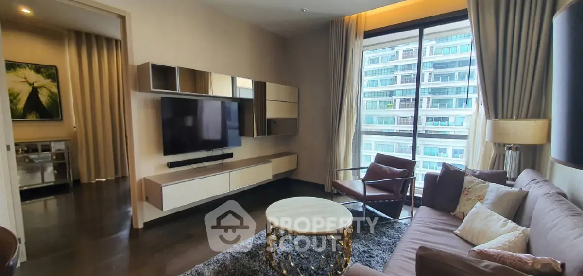 Luxurious living room with modern decor and large window offering city view