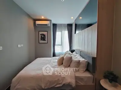 Cozy modern bedroom with stylish decor and natural light