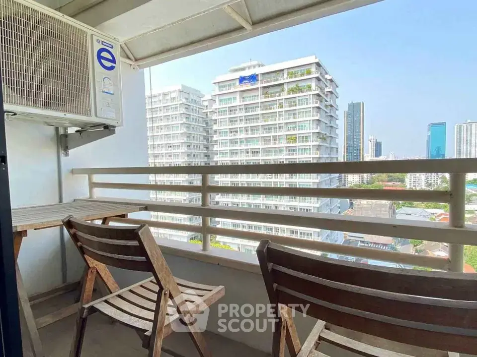 Charming balcony with city view, perfect for relaxation and enjoying the skyline.