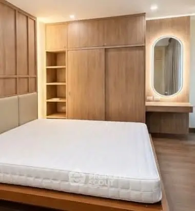 Modern bedroom with wooden furniture and stylish lighting