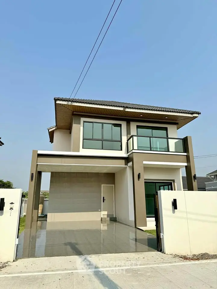Modern two-story house with sleek design and spacious driveway