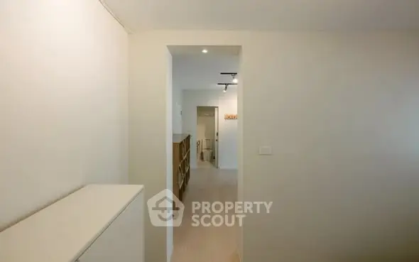 Modern minimalist hallway with sleek design and neutral tones