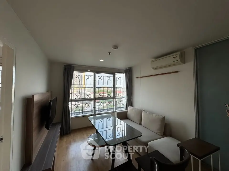 Cozy living room with modern furniture and large window view