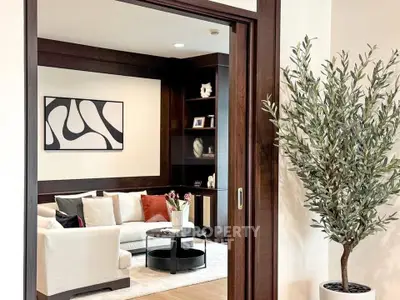 Elegant living room with modern decor and cozy seating area, perfect for relaxation and entertaining.