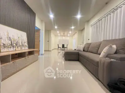 Spacious modern living room with sleek sofa and elegant decor