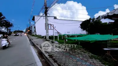 Street view of urban area with adjacent building and sidewalk