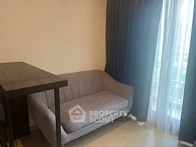 Cozy living room with modern sofa and large window with city view