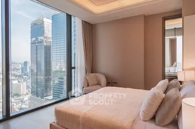 Luxurious bedroom with stunning city view in high-rise apartment