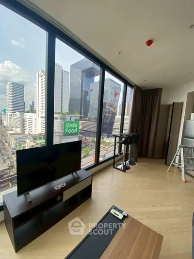 Modern living room with stunning city view and sleek furnishings