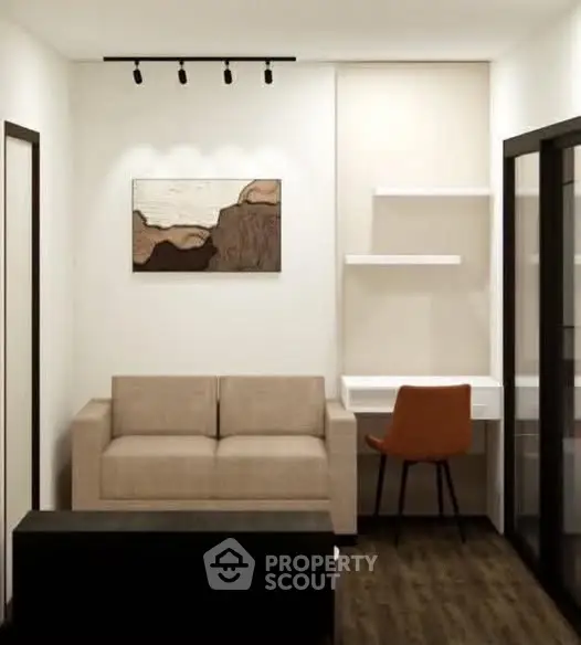 Modern living room with beige sofa, wall art, and sleek desk setup.
