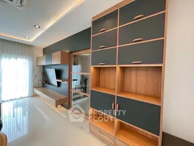 Modern living room with sleek built-in shelving and natural light