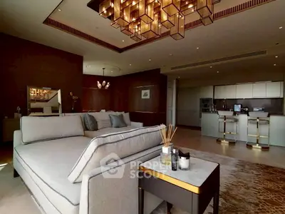 Luxurious open-plan living room with modern kitchen and elegant lighting