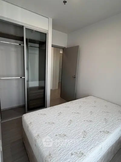 Modern bedroom with built-in closet and minimalist decor