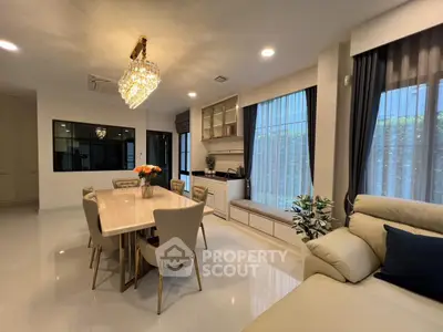 Luxurious living room with elegant chandelier and modern furniture