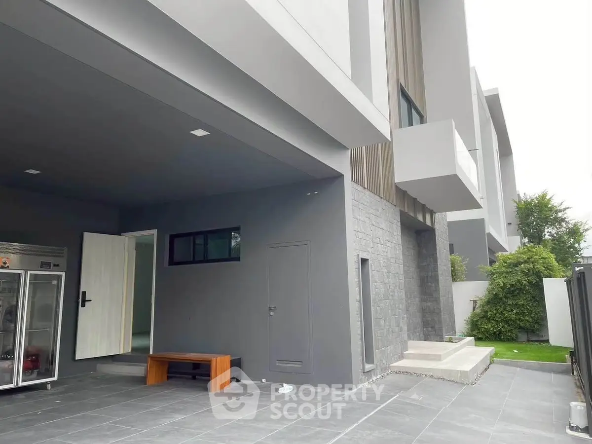 Modern exterior view of a stylish home with sleek design and spacious outdoor area.
