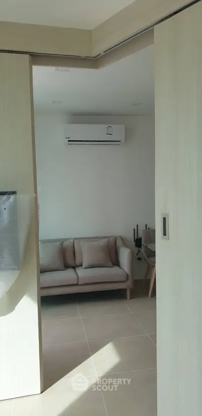 Modern living room with air conditioning and cozy sofa