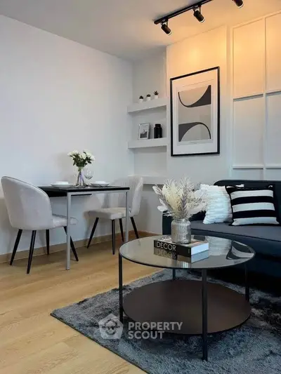 Stylish modern living room with elegant decor and cozy seating area.