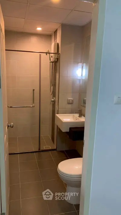 Modern bathroom with sleek design and glass shower enclosure