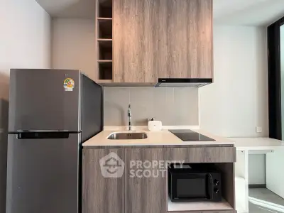 Modern kitchen with sleek cabinetry, built-in appliances, and compact design ideal for urban living.