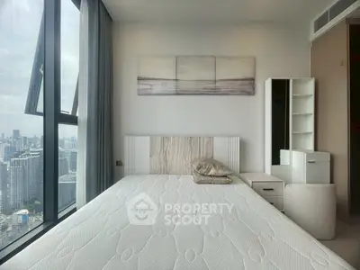 Modern bedroom with city view and stylish decor