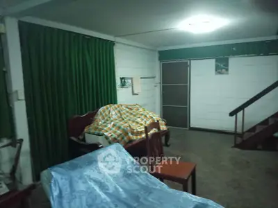 Cozy living room with green curtains and wooden furniture