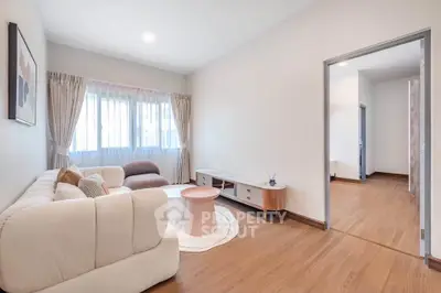 Spacious modern living room with elegant decor and natural light