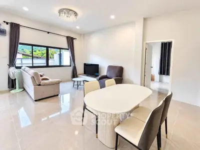 Spacious modern living room with elegant furniture and large windows