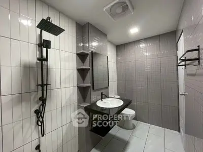 Modern bathroom with sleek fixtures and stylish tile design