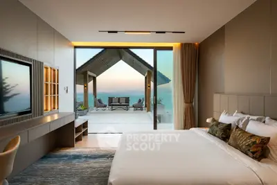 Luxurious bedroom with ocean view and spacious balcony in modern villa