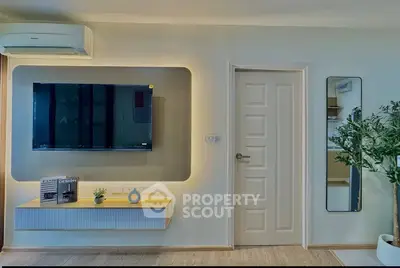 Modern living room with wall-mounted TV and stylish decor