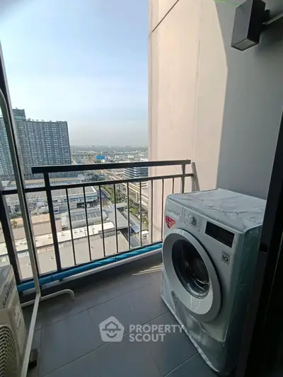 High-rise balcony with washing machine and stunning city view