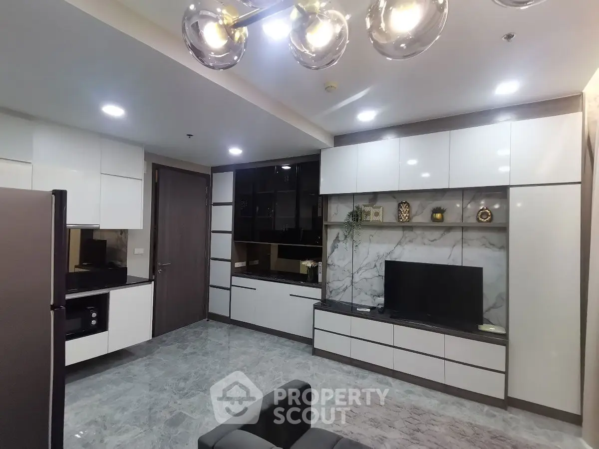 Modern living room with sleek cabinetry and marble accents