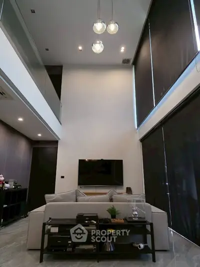 Modern living room with high ceiling and stylish decor in luxury apartment