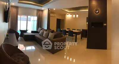 Spacious modern living room with elegant dining area and stylish lighting