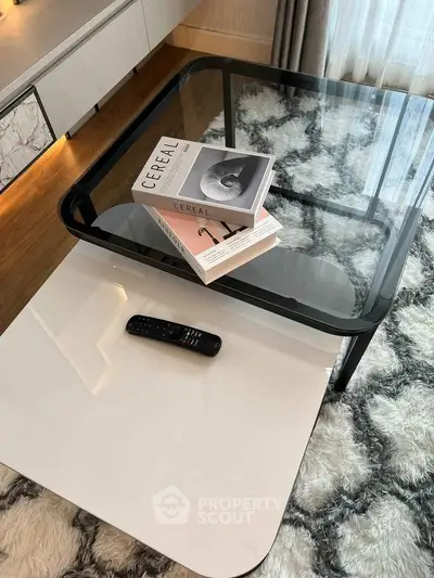 Stylish modern living room with glass coffee table and chic decor