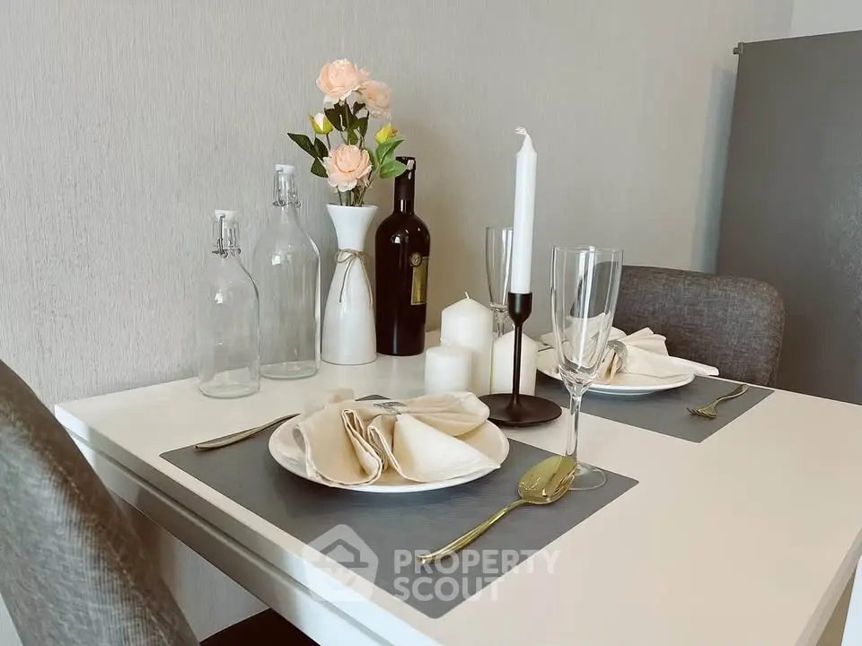 Elegant dining setup with modern decor and stylish tableware in a cozy apartment.