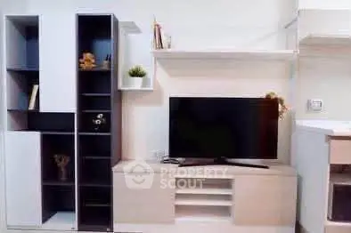 Modern living room with sleek TV unit and stylish shelving